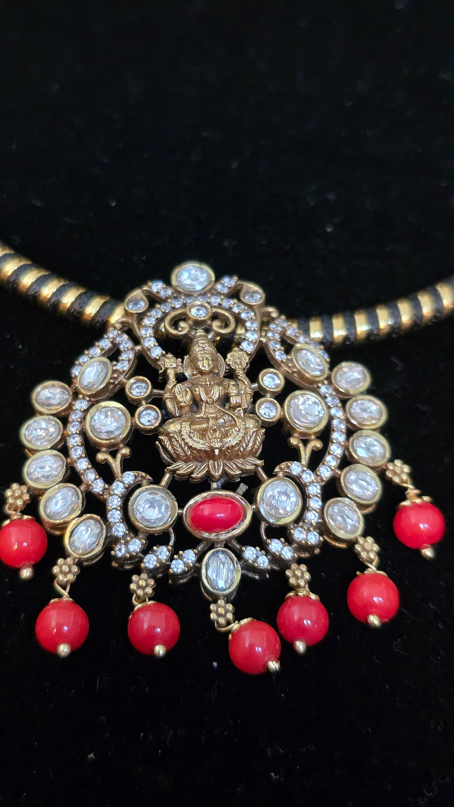 Black hasli with laxmi pendent with coral beads